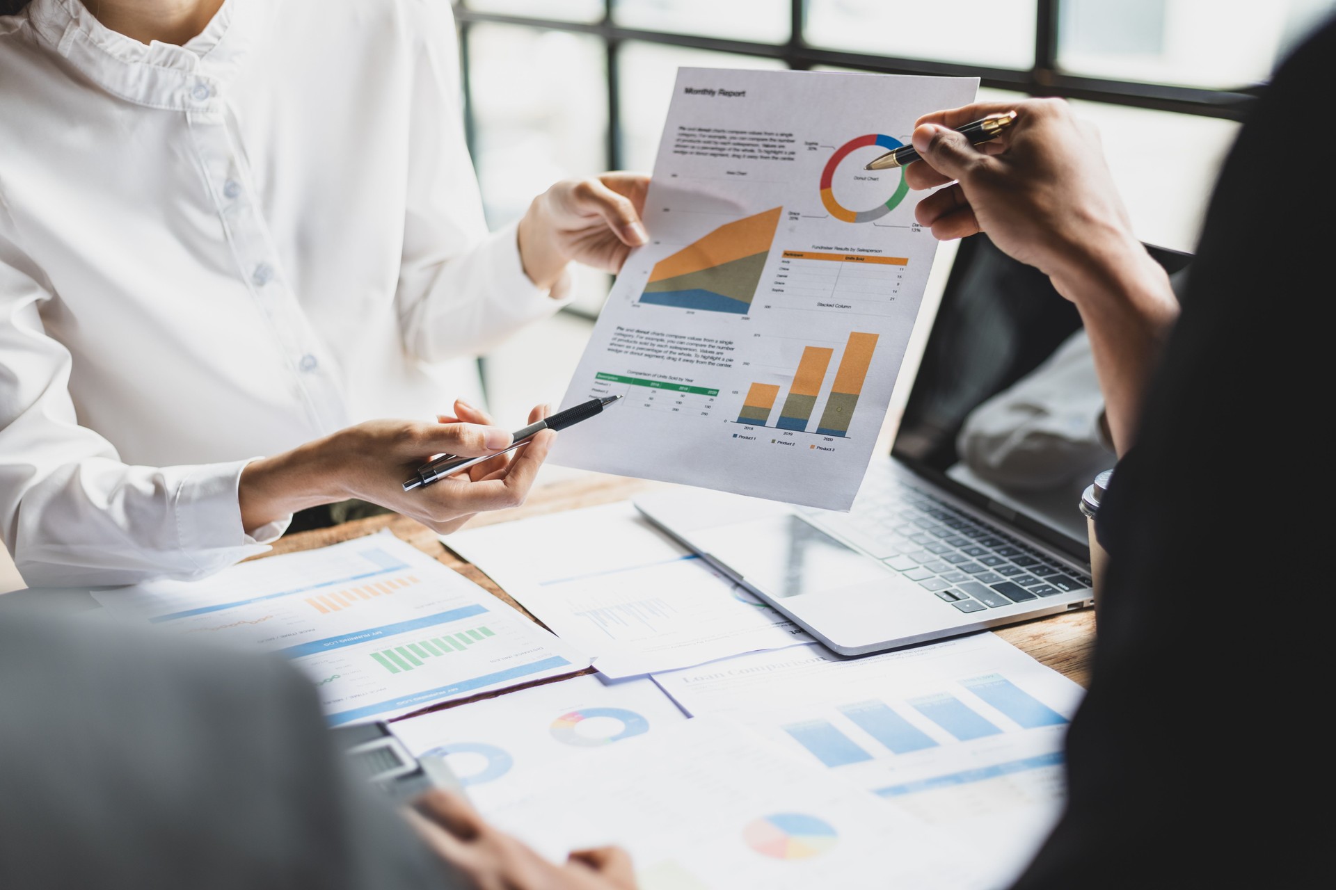 Colleagues meeting, business partners are analyzing the company's investment situation and brainstorming plans for new business projects. Strategy analysis and business planning